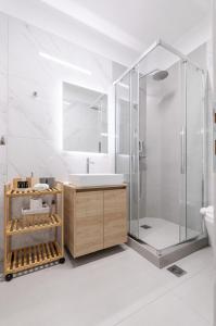 a bathroom with a shower and a sink at KAPA Luxury Living in Volos +11 photos