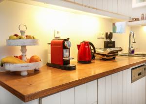 a kitchen counter with a counter top with fruit on it at EMELIAS HOUSE SEA SIDE in Naxos Chora +37 photos