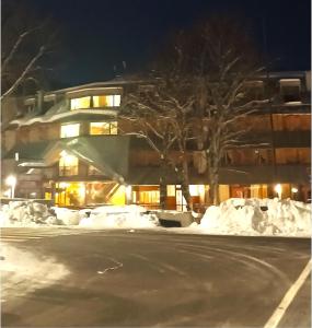 a building with snow on the side of a street at Terminillo Lo chalet in Terminillo