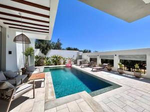 a swimming pool in the middle of a house at Villa Ulysse 4 Bedroom Private Pool in Hammamet