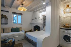 a bedroom with a bed and a fireplace at Theasea luxury retreat in Vrachonisída touArchangélou