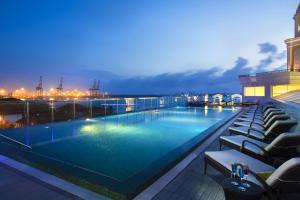 a large swimming pool on top of a building at Fragrant Nature Kochi - A Five star Classified Hotel in Cochin