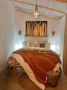a bedroom with a large bed in a room at Qenqo's House in Cusco