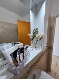 a bathroom with a sink and a mirror at Center Cruz del Eje in Cruz del Eje