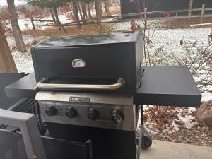 a grill sitting on top of a stove at Cree Bay Cabin in Breezy Point