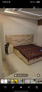 a bedroom with a large bed in a room at RYIZ Villa in Agra