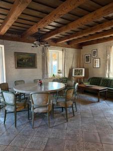 a dining room with a table and chairs at Akacjowe Wzgórze in Wielęcin