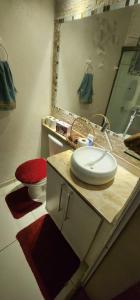 a bathroom with a sink and a toilet at Apê do ladinho de Alphaville in Osasco