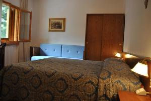 Postel nebo postele na pokoji v ubytování Hotel Archimede