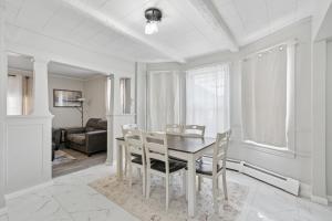 a dining room with a table and chairs at Home In Highland Park in Saint Paul +21 photos