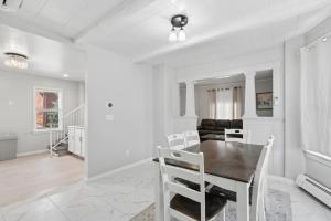 a dining room with a table and chairs at Home In Highland Park in Saint Paul