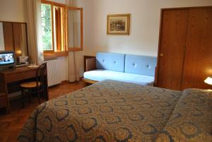 Postel nebo postele na pokoji v ubytování Hotel Archimede