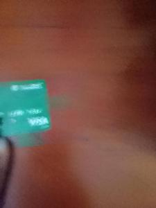 a blurry picture of a green sign on a table at Mage B&B 1 in Roseau