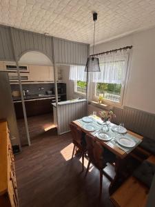 a kitchen with a table with plates on it at Jarmila in Tachov