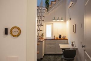 a kitchen with a stairway leading to a dining room at Casa Martù in Palermo +42 photos