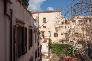 an alley in an old town with buildings at Casa Martù in Palermo