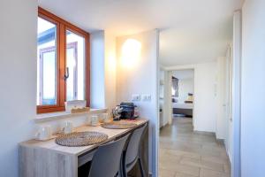a kitchen with a table and chairs in a room at Tauromenion Guest House in Taormina +36 photos