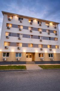 a large building with windows on the side of it at Nicolle Prestige Apartment in Piteşti