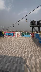 a skateboard ramp with graffiti on the side of it at Studio Apartment with Rooftop & Pool Access in Lagos