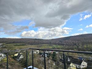 a view of a valley from a balcony at Luxus-Penthouse mit Panorama-View in Netphen