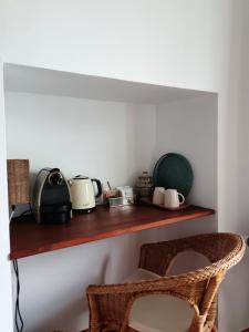 a shelf with a toaster and a microwave on it at La Locana in Bubión
