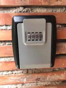 a light switch attached to a brick wall at Stanza con terrazzo vista lago LAKEHOLIDAY IT in Castel di Tora