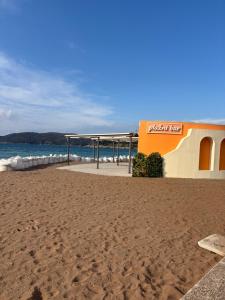 a building on a beach next to the ocean at Galicia Hills in Bečići