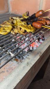 a grill with a bunch of food on it at Mi bohío in Monteverde