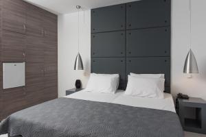 Postel nebo postele na pokoji v ubytování Galaxy Hotel