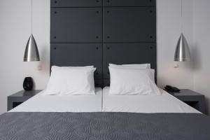 Postel nebo postele na pokoji v ubytování Galaxy Hotel