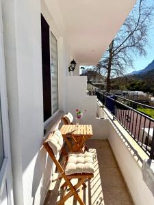 a balcony with a table and chairs on a balcony at Eda Sultan Guesthouse - 5 Min Walk to Göynük Beach in Kemer