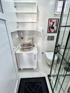 a bathroom with a sink and a toilet at Eda Sultan Guesthouse - 5 Min Walk to Göynük Beach in Kemer +35 photos