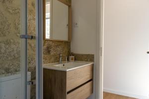 a bathroom with a sink and a mirror at Casa de Algeriz in Algeriz +55 photos