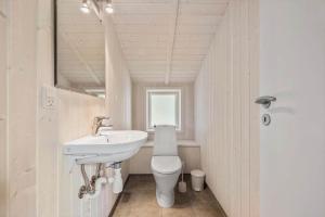 a bathroom with a sink and a toilet at VE303-Oksbol-Kaervej-2 in Oksbøl +10 photos