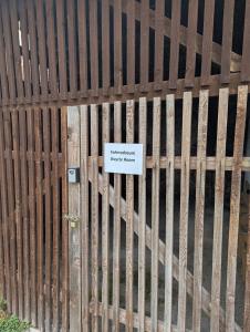 a wooden fence with a sign on it at ANKU's in Krems an der Donau