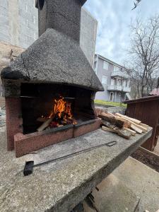a brick oven with a fire inside of it at Ana & Stela in Karlobag