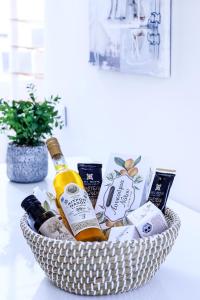 a basket filled with bottles of wine on a table at EMELIAS HOUSE SEA SIDE in Naxos Chora