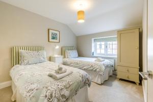 a bedroom with two beds and a window at 3 Bed in Knapton oc-1191 in Knapton