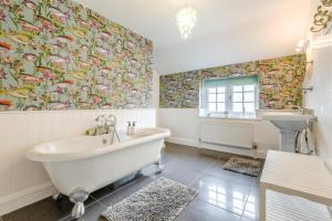 a bathroom with a tub and a sink at 3 Bed in Knapton oc-1191 in Knapton +13 photos