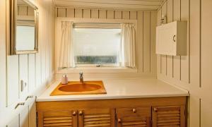 a bathroom with a sink and a window at VE465-Vejers-Strand-Violvej-1A in Vejers Strand +19 photos