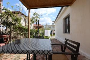 a table and chairs sitting on a patio at Elbasan Backpacker Hostel in Elbasan +135 photos