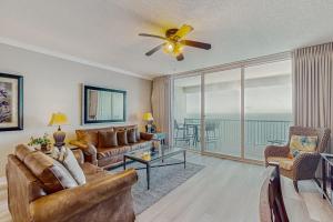 a living room with a couch and a ceiling fan at Palazzo 1304 in Panama City Beach