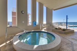 a large hot tub in a building with a pool at Palazzo 1304 in Panama City Beach