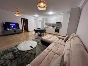 a living room with a couch and a table at 365 Apartments in Bucharest in Bucharest