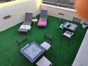 a group of chairs and tables on a patio at CASA DEL CORSO in Dorgali