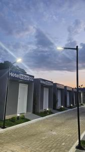 a building with a street light in front of it at Hotel In Box - Roseira in Roseira