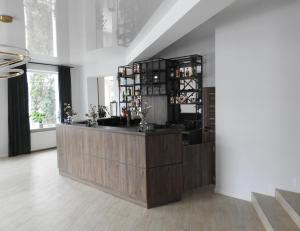 a room with a counter with wine bottles at Cliff House & Restaurant in Żary