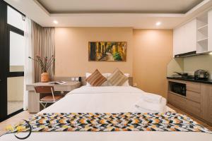 a hotel room with a bed and a desk at An Yên Island - Art Boutique Stay with Dual Lake view in Hanoi