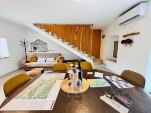 a dining room with a table and a couch at Casa Viva in Umag +24 photos