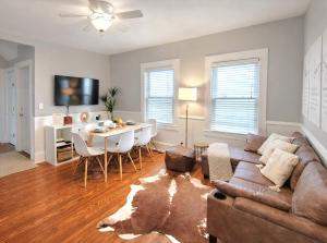 a living room with a couch and a table at Luxe 3BR Apartment at MIT Harvard with FREE parking in Cambridge +14 photos